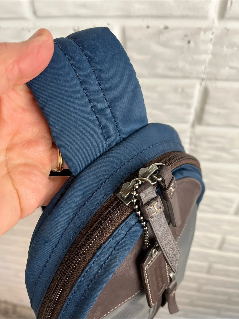 COACH Varick sling bag in navy blue / gray nylon with brown leather trim